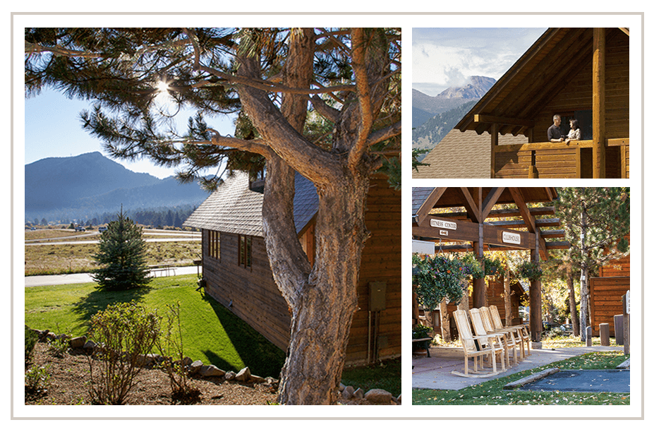 Wooden lodge building with large tree and mountain valley view in background